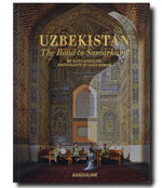 Front cover of a book titled "Uzbekistan: The Road to Samarkand" by Assouline with photography by Laziz Hamani, featuring a group of musicians in traditional costumes.