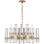 The Bonnington Chandelier by Visual Comfort features a hand-rubbed antique brass finish with crystal prisms arranged circularly, an E12 candelabra base, and a sleek canopy, enhancing its luxurious appeal.