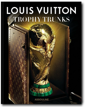 Cover of Assouline’s "Louis Vuitton Trophy Trunks" featuring the FIFA World Cup trophy displayed in a signature Louis Vuitton custom case.