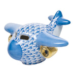 The Herend Airplane, Blue is a porcelain figurine with hand-painted scale patterns in blue and white and gold-colored engines, displayed on a plain white background.