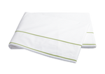 The Matouk Ansonia Bedding Collection, Leaf features a folded white bedsheet with two parallel green lines near the edge, crafted from luxurious Egyptian cotton percale and displayed on a white background—ideal for luxury bedding seekers.