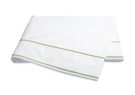 The Matouk Ansonia Bedding Collection, Leaf features a folded white bedsheet with two parallel green lines near the edge, crafted from luxurious Egyptian cotton percale and displayed on a white background—ideal for luxury bedding seekers.