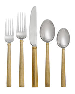 The Michael Aram Wheat 5-Piece Flatware Set, Gold, features two forks, a knife, a soup spoon, and a teaspoon with textured goldtone handles—elegantly arranged on a white background; a perfect gift.