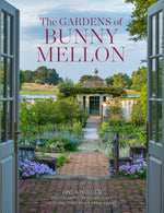 The "Gardens of Bunny Mellon" by Common Ground features a cover depicting a flower-lined path leading to a charming building under a clear blue sky, reflecting her iconic garden design.