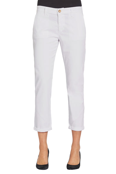 A woman wearing AG Jeans Caden Chino relaxed fit white trousers.