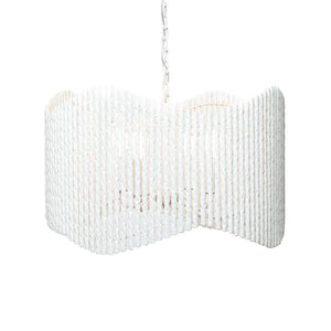 The Camille Chandelier by Made Goods features a white, wavy cylindrical shade made of vertically twisted plaster bars, suspended by a chain against a plain background.