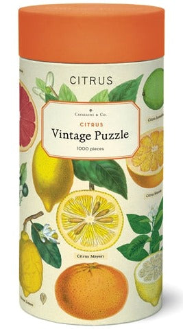 A Cavallini & Co. Citrus 1,000 Piece Puzzle in a muslin bag with a vintage citrus fruit design by Cavallini Papers and Co.
