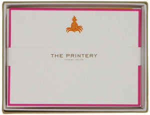 The Printery Pineapple Card Set features notecards with a gold pineapple emblem and hot pink borders, crafted in Oyster Bay, New York.
