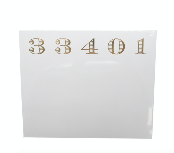 White square Black Ink notepad holder with the number "33401" in gold, serif font on a luxurious quality background.
