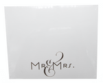 The Black Ink Mr & Mrs Large Notepad features a white square Lucite holder with "Mr & Mrs." in elegant black script, perfect for keeping your favorite notes organized.