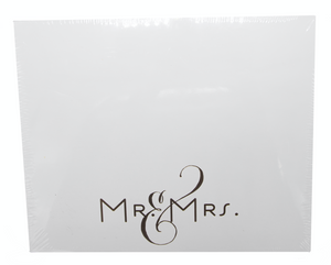 The Black Ink Mr & Mrs Large Notepad features a white square Lucite holder with "Mr & Mrs." in elegant black script, perfect for keeping your favorite notes organized.