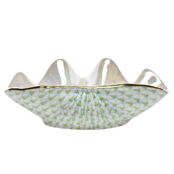 A Herend Clam Shell, Key Lime Green bowl with a gold trim.
