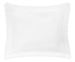 The Matouk Diamond Pique Bedding Collection in white features a pillow with scalloped edges and a diamond-patterned pique, shown against a white background.