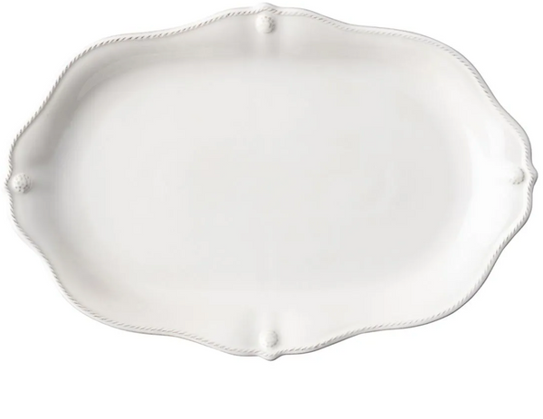 An empty, scalloped white ceramic stoneware serving platter with decorative edges from the Juliska Berry & Thread Whitewash Platter, 16" Collection.