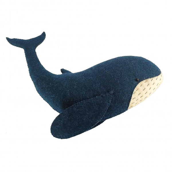 A handcrafted Fiona Walker Mini Whale Wall Decoration shaped like a blue whale isolated on a white background.