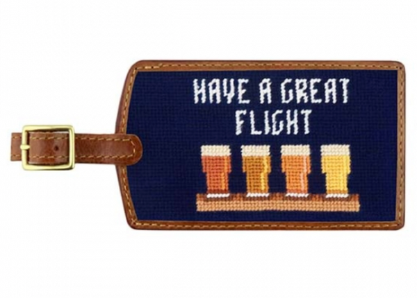Navy blue Smathers & Branson Beer Flight luggage tag with "have a great flight" text and three beer mugs embroidered in yellow, attached with a durable leather strap.