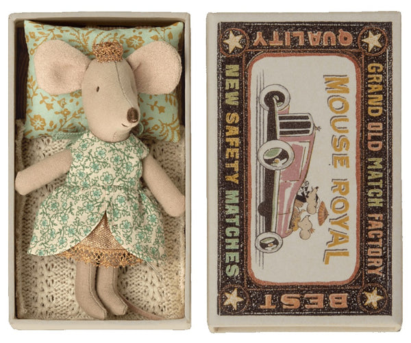 Fabric Maileg Princess Little Sister Mouse in Box inside a decorative matchbox-style bed next to its packaging, adorned with a golden tiara.