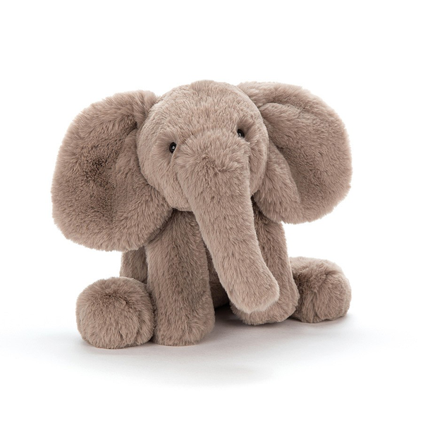 A stuffed elephant lying down on a white background from Jellycat.