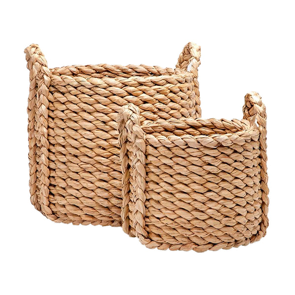 Two Raquel Woven Seagrass Round Baskets with handles by Made Goods, isolated on a white background.