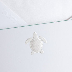 The Printery Turtle Card Set features a white card with an embossed turtle design and beveled edges, partially covering a matching white envelope in the background.
