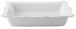 The Juliska Berry & Thread Whitewash 17.5" Rectangular Baker features scalloped edges and a ceramic stoneware design—ideal for preparing oversized holiday recipes.