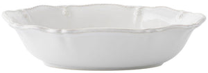 The Juliska Berry & Thread Whitewash 12" Oval Serving Bowl features a scalloped edge and embossed details, offering an elegant touch to any table. Shown against a plain background, it's perfect for entertaining.