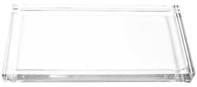 The Lucite Tray Large by L'Avant Collective is a clear rectangular acrylic tray with raised edges and a minimalist design, shown on a white background.
