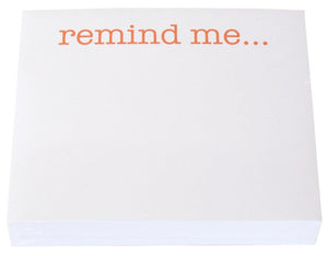 The Remind Me Large Notepad by Black Ink features "remind me..." in orange atop high-quality white paper, ideal for use with any Lucite Notepad Holder.