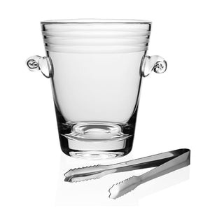 The Madison Ice Bucket with Tongs by William Yeoward Crystal is a clear, handmade glass ice bucket featuring frosted stripes and two round side handles, paired with metal tongs and displayed against a white background.