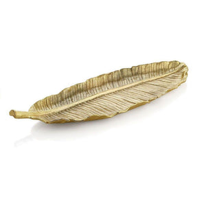 The Michael Aram New Leaves Large Banana Leaf Platter, a gold-toned decorative tray, adds sculptural, nature-inspired style to any space. Displayed on a white background.