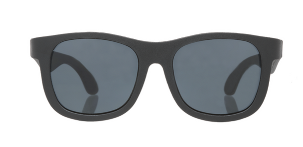 A pair of black Babiators Navigator Polarized Sunglasses with tinted UV400 lenses against a white background.