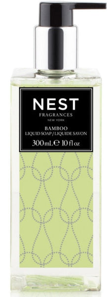 A bottle of NEST Bamboo Liquid Soap with a lime design on it, enriched with natural plant extracts.