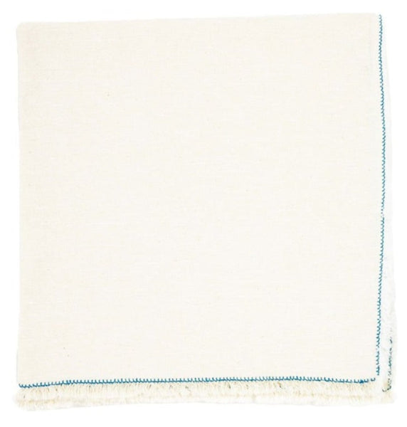 A Deborah Rhodes Nomad Stitch Fringe Napkin, Set of 4, in white with blue trim.