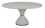 The Parrot Dining Table by Mr Brown is a round wooden dining table with a solid oak, hourglass-shaped pedestal base, enhanced with metal accents for a modern look.