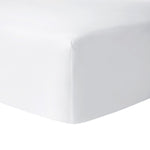 Close-up of the Yves Delorme Roma Blanc Fitted Sheet, a solid white percale fitted sheet in luxury combed cotton, 500 thread count, shown covering a mattress corner.
