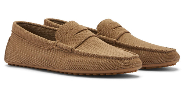 A pair of Peter Millar Cruise Knit Driver brown men's loafers with breathable performance uppers on a white background.