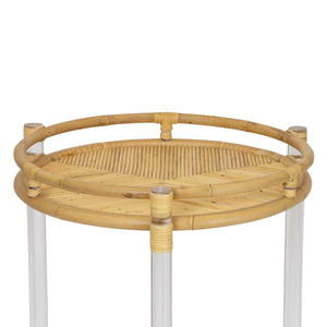 The Selamat Acrylic and Rattan Bar Cart features a round bamboo tray with a rim, supported by transparent cylindrical legs, making it a versatile addition to your Sea Cliff-inspired decor.