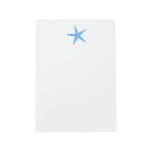 The Printery Starfish Notepad is a bone white pad with a single Ness Blue Starfish printed at the top center.
