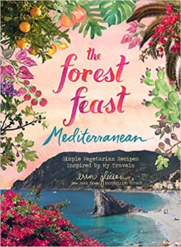 A colorful cookbook cover titled "The Forest Feast Mediterranean" by Abrams featuring illustrations of fruit, plants, and a Mediterranean coastal scene.