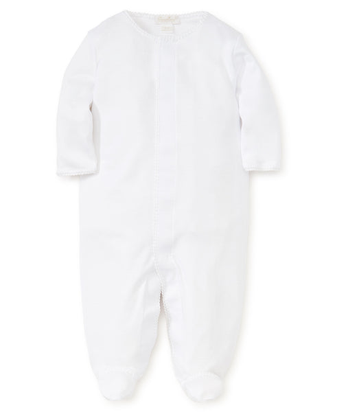 White Kissy Kissy Premier Basics Footie with long sleeves and enclosed feet, featuring a front zipper and a delicate trim around the neckline for easy changing.