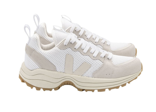 A pair of Veja Women's Venturi Alveomesh Sneakers, crafted from recycled materials, with mesh detailing and chunky beige soles, isolated on a white background.