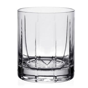 The Vesper Double Old Fashioned Tumbler by William Yeoward Crystal features a faceted geometric base for a modern look, shown empty against a plain white background.