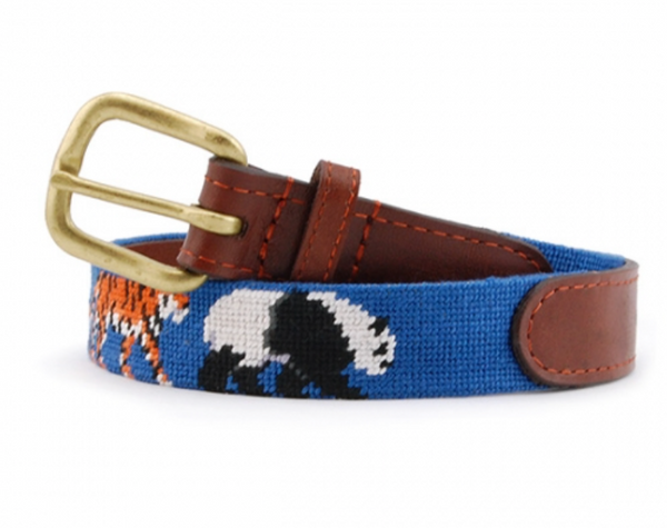 A Smathers & Branson Children's Zoo Belt with a woven panda design in white and black, featuring a brown leather trim and a brass buckle.