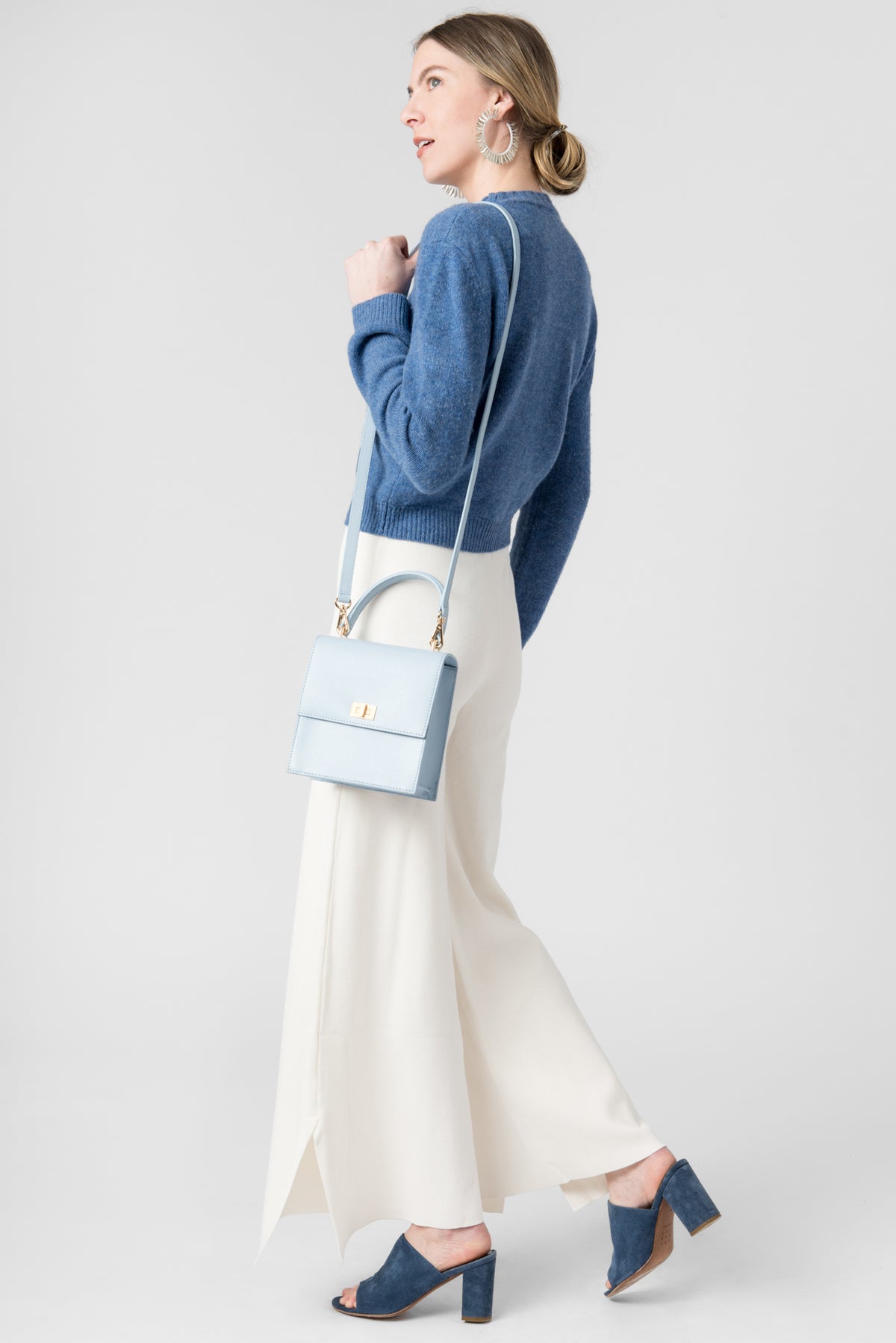 image of model with Neely & Chloe blue shoulder bag