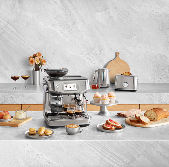 breville appliances next to cutting boards displaying food