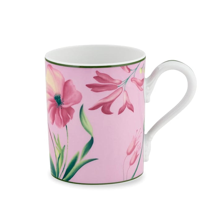 A pink ceramic mug from the Ginori 1735 Florenza Impero Malva Dinnerware and Decor Collection, featuring a curved handle and adorned with an elegant motif of pink and yellow flowers with green leaves, inspired by the refined beauty of Italian porcelain and classic Tuscany tableware.