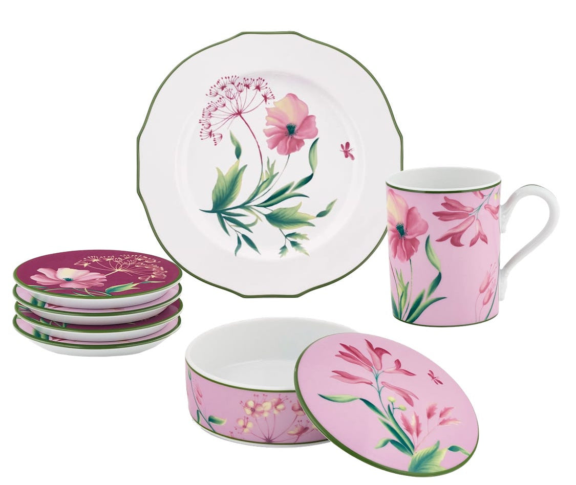 The Florenza Impero Malva Dinnerware and Decor Collection by Ginori 1735 features a Tuscan-inspired floral design with pink flowers on white and pink backgrounds, and includes a plate, four coasters, a mug, and a round container with lid.