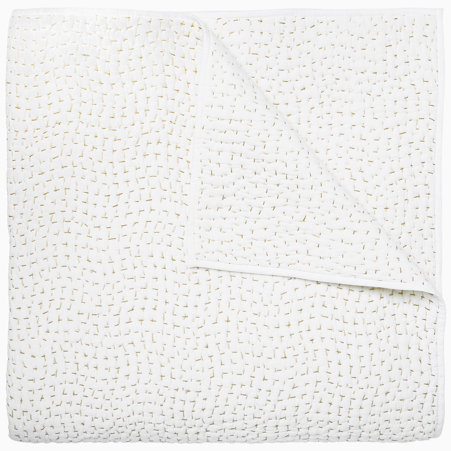 A white coverlet from the Hand-Stitched Bedding Collection by John Robshaw, featuring a subtle stitched pattern and organic cotton, is neatly folded with one corner turned down to reveal its detailed texture.