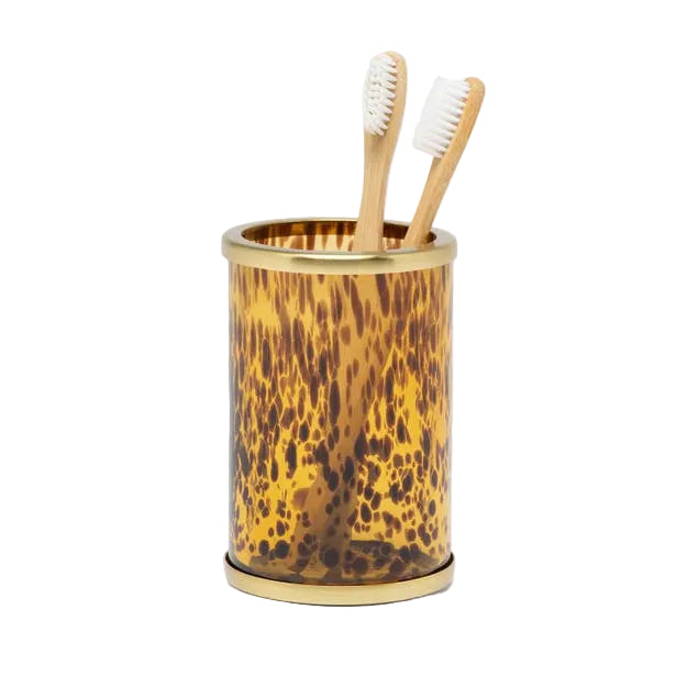 The Benton Tortoise Bath Collection toothbrush holder by Pigeon & Poodle, with its brown and gold speckled finish and two wooden brushes, brings elegant style to your bath décor against a white background.