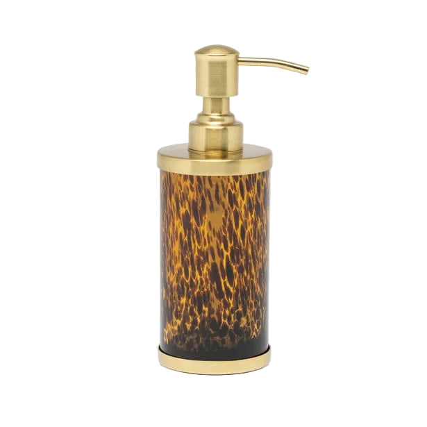 Add elegance to your bath with the Benton Tortoise Bath Collection by Pigeon & Poodle, featuring a gold pump and cylindrical container with a brown and black animal print.